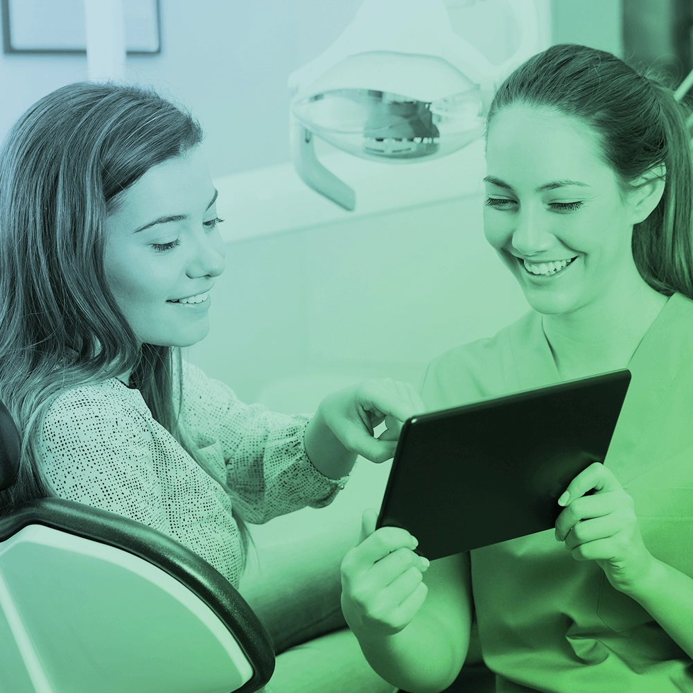 Dentist talking to patient.