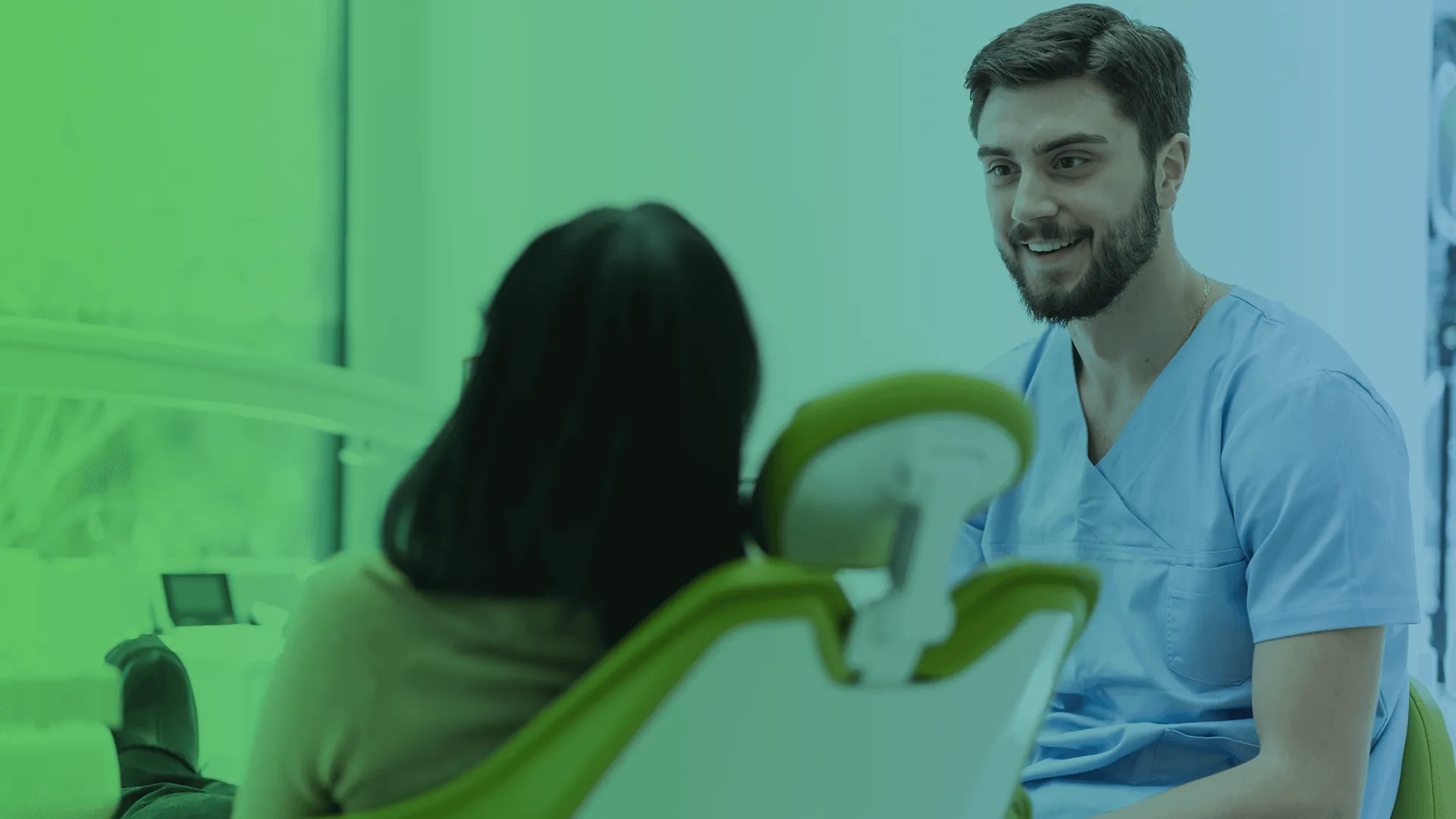 Dentist talking to patient.