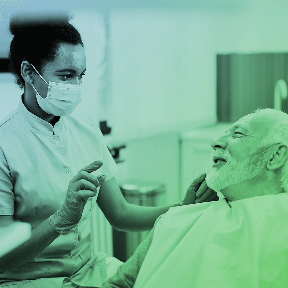 Dentist talking to patient.