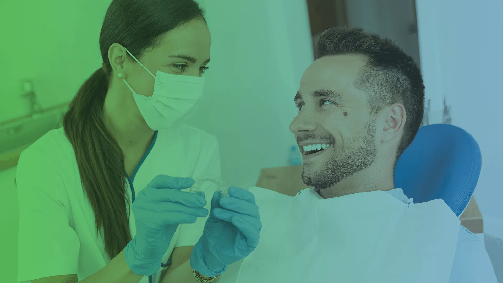 Dentist showing invisalign to a patient.