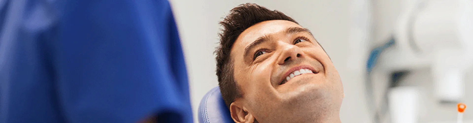 Patient-smiling-up-at-dentist.