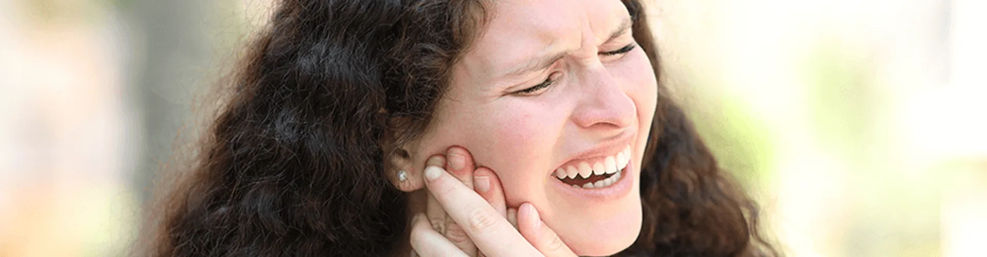 A woman with toothache.