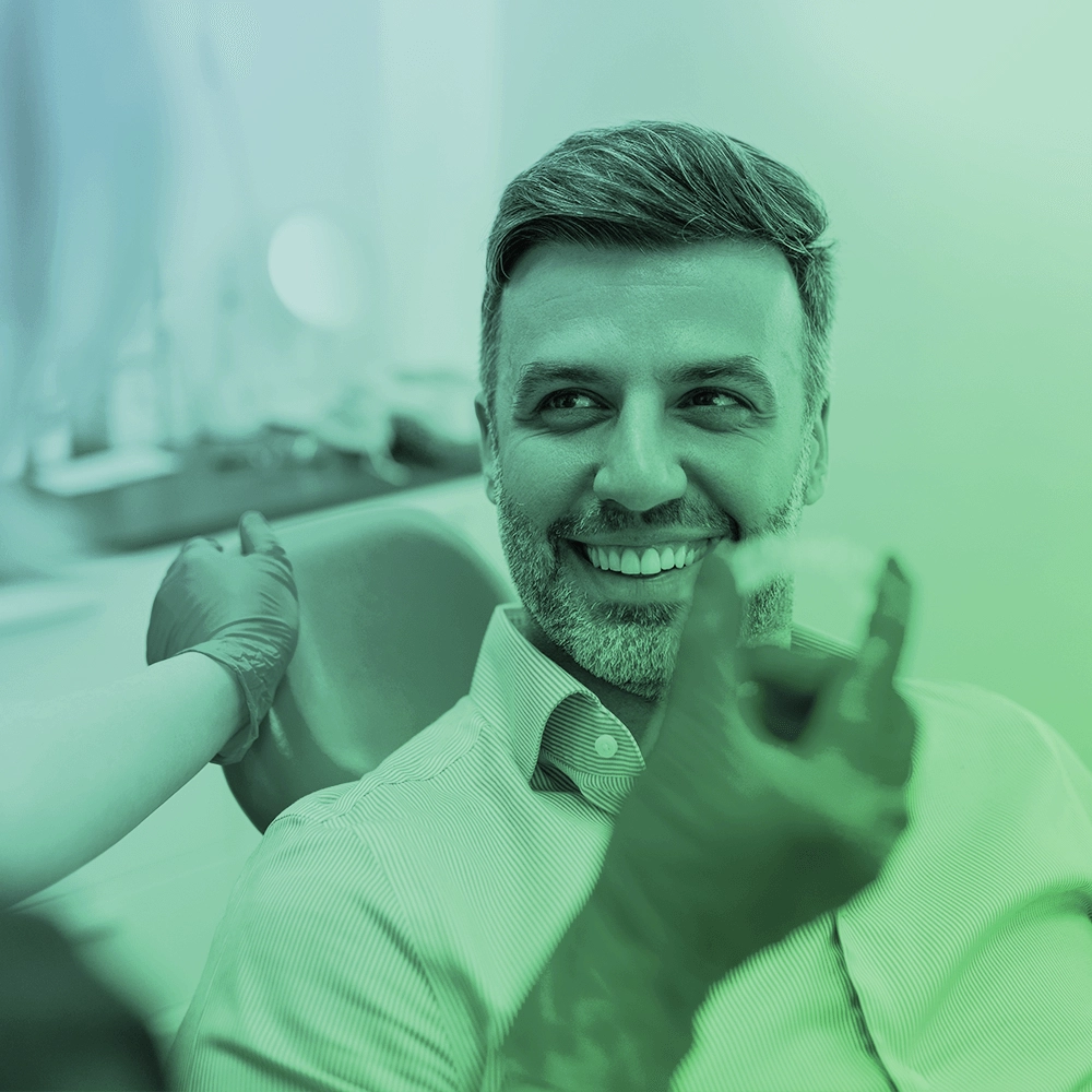 Dentist showing aligner.